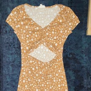 Mustard Floral Jessica Simpson Mini dress with cut out in front!